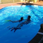 Nath and Elokin swimming in the pool